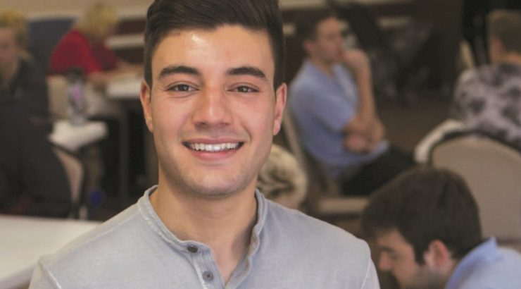 Jacob Pace, a student who coordinates tech help for seniors in Orange