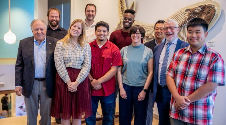 Gary Wescombe with President Daniele Struppa, faculty, alumni and students at the announcement of the Wescombe STEM Scholarship at Schmid College Oct. 3.