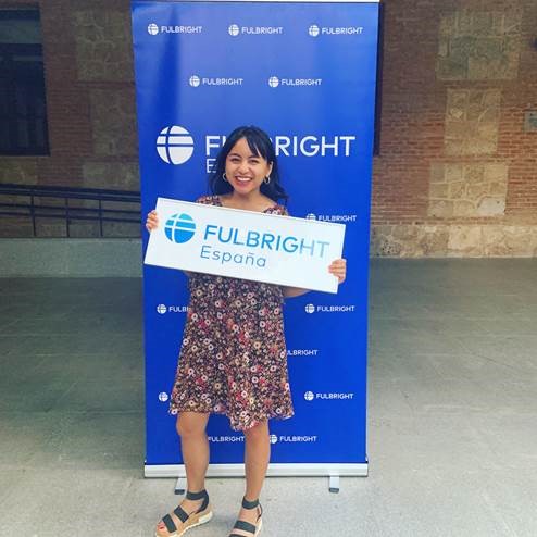 Carmina holding Fulbright sign