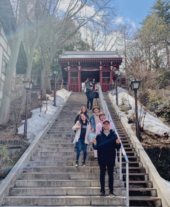 Students on steps in front of Japan temple