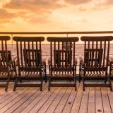 Chairs on a ship deck during sunset