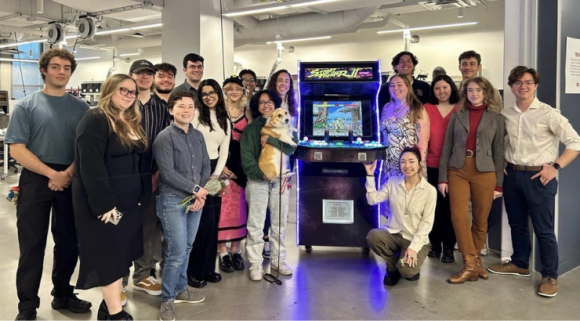Ethan Tapia and Chapman University students pictured with the Corgicade project in Swenson Hall Tech Shop 